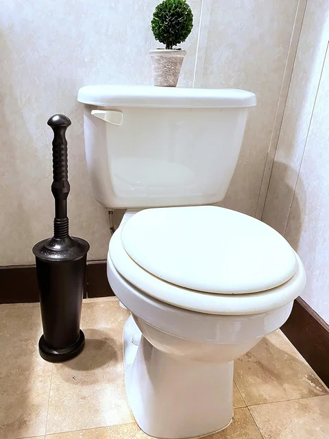 Clearing clogs in low-flush toilets